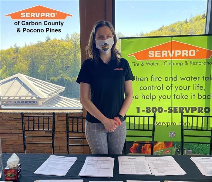 A SERVPRO worker at our table for a job fair!